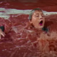 Augustus Gloop in the chocolate river in "Willy Wonka and the Chocolate Factory"